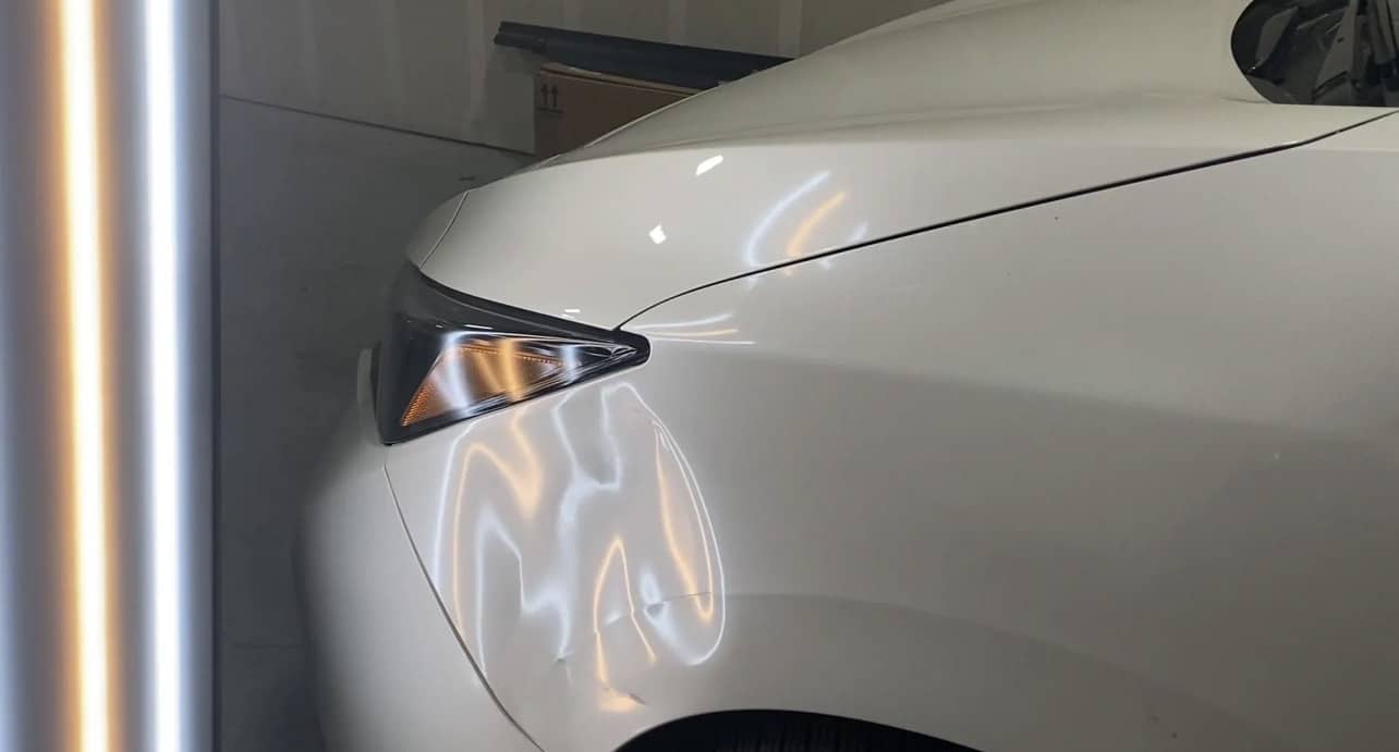 close-up of car dent before repair in Bronx NY