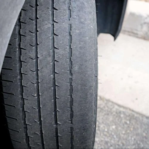 Tire tread wear caused by poor wheel alignment